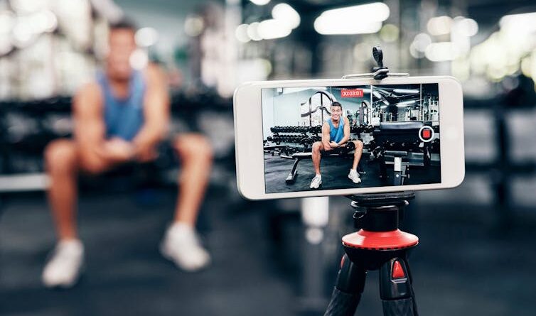 A man filming a gym